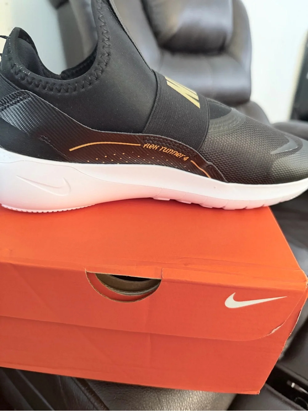 Nike Men’s Slip-On Sneakers in Black and Gold Accent